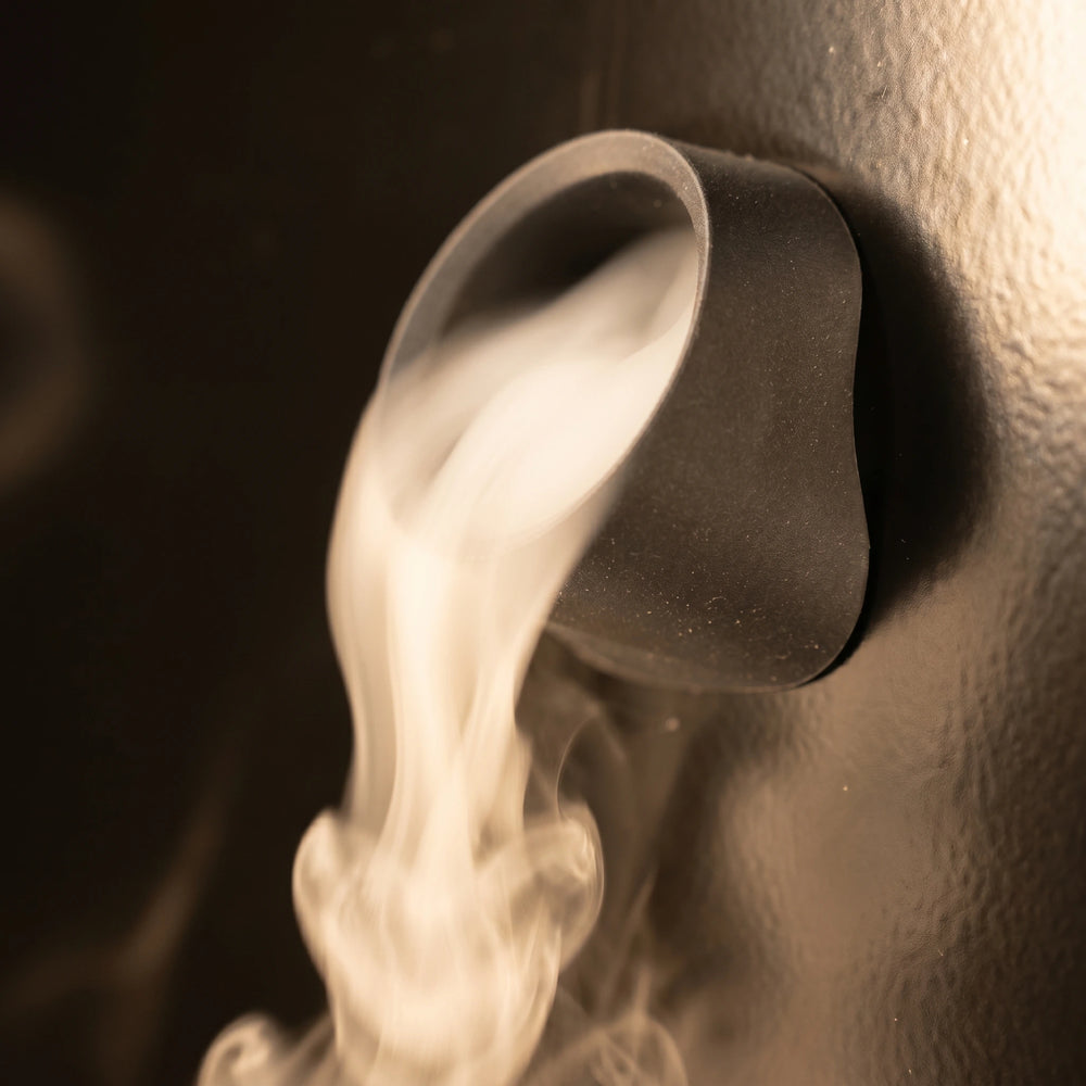 Fog drifting through a pod holder