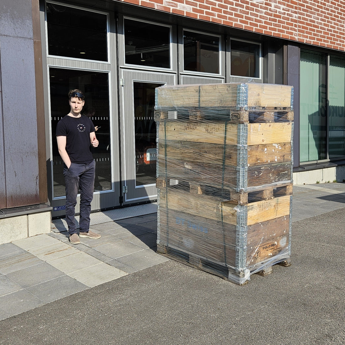 Vext co-founder Niklas Bärlund with the first shipment of Vext smart garden cabinet parts