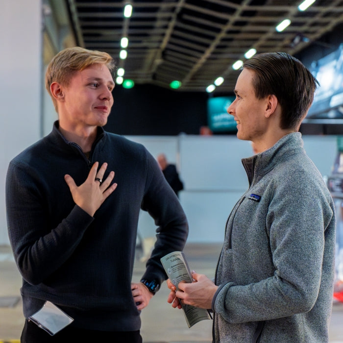 Team members Kasper and Niklas discussing at Viini ja Ruoka messut